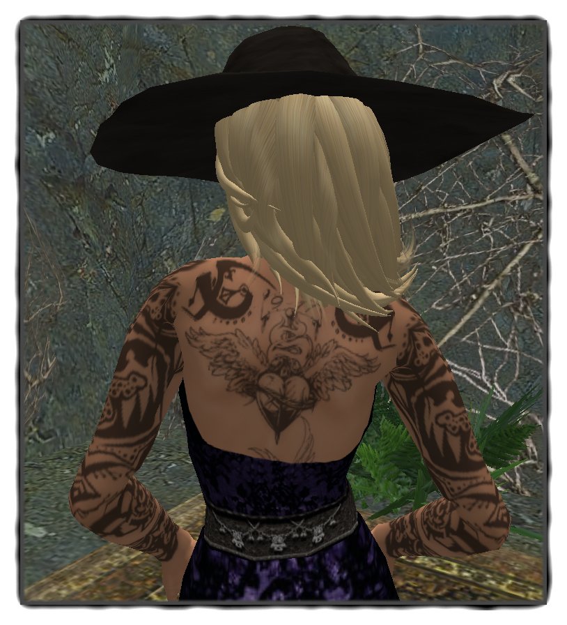 The beautiful tattoo is from Inflict. Hat with hair: Frangipani Designs 